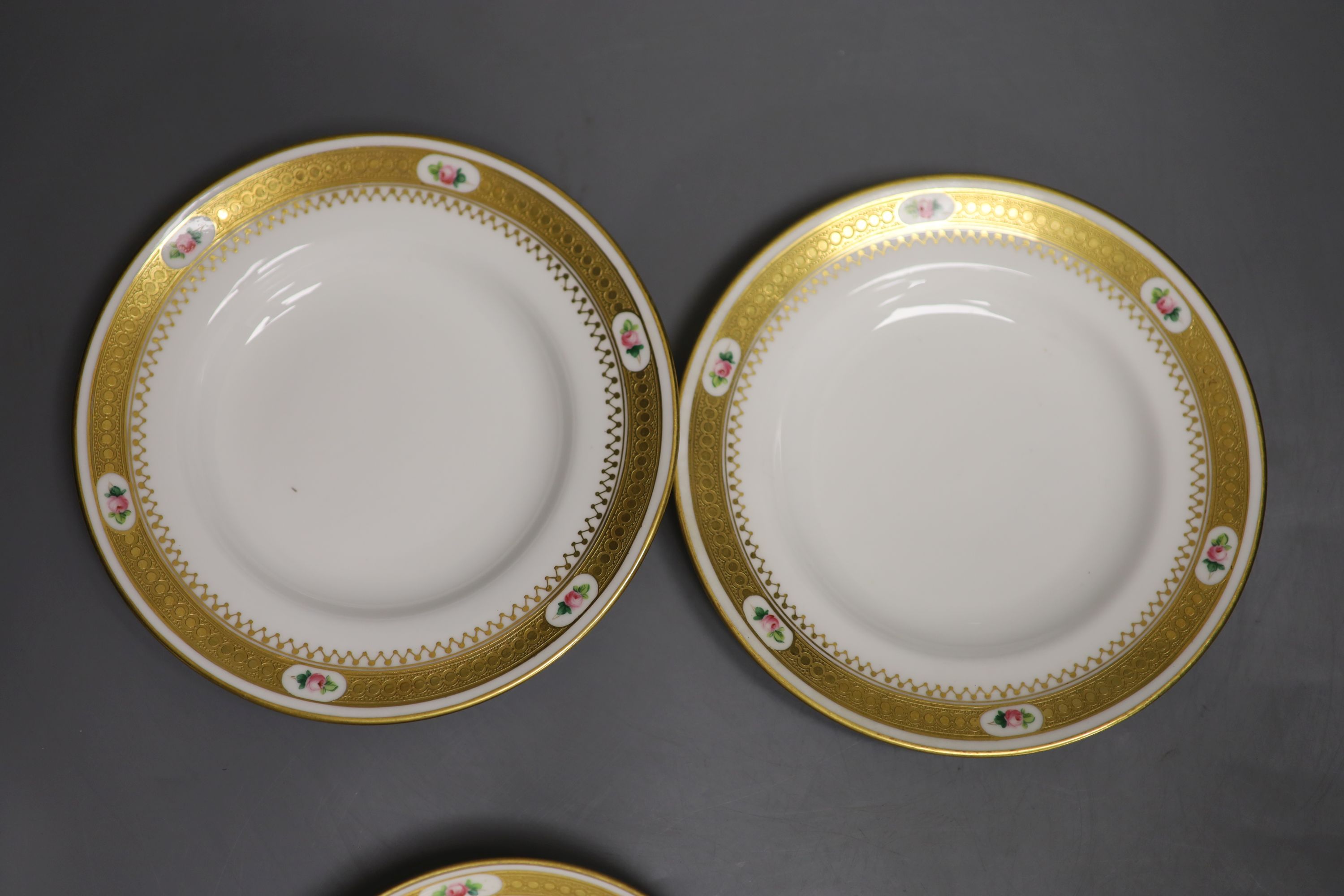 A pair of Minton coffee cups and saucers & pair Minton trios